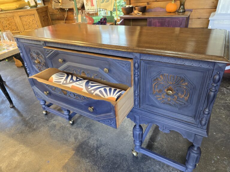 1920’s Jacobean Revival Sideboard Buffet in classic Navy with exposed wood completely refinished.  New hardware, casters and classic hardware. Spoonflower wallpaper as shown upon request. $1150.