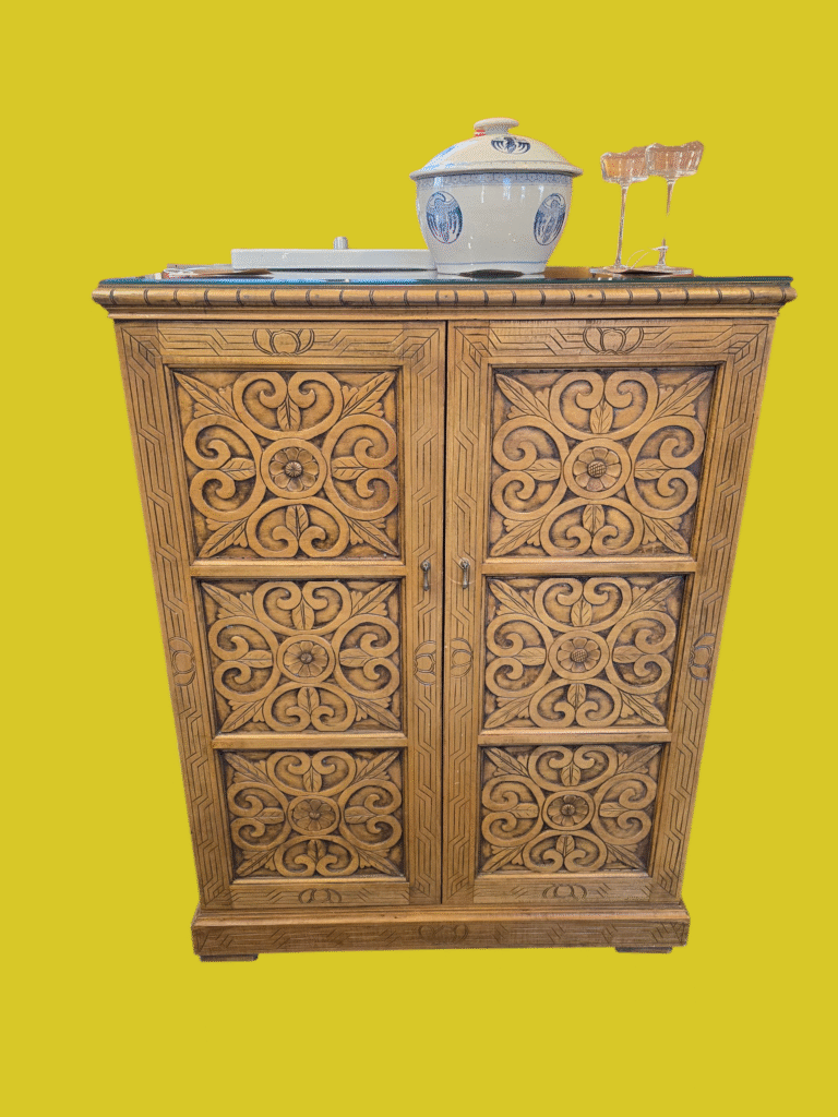 This pretty piece would make a great hideway liquor cabinet.